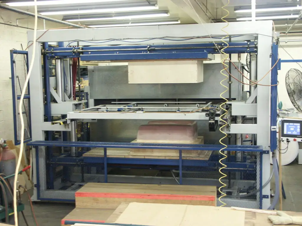 Vacuum forming machine in the Plastic-Craft Products fabrication shop